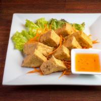 Crispy Tofu Triangle · Crispy tofu served with Thai sweet and sour sauce topped with crushed peanuts. Vegetarian.