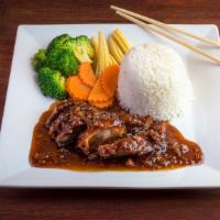 Tamarind Duck Lunch · Crispy duck topped with our house tamarind sauce and fried red onions with steamed broccoli,...