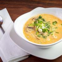 Tom Khai Gai · Creamy coconut soup with galanga broth with chicken, mushrooms, scallions and cilantro.