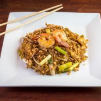 Pad Thai · Rice noodles in pad Thai sauce with chicken and shrimp, bean sprouts, scallions and egg topp...