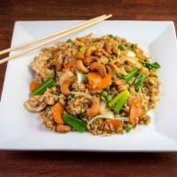Green Curry Fried Rice · Fried rice with egg, carrots, peas, onions, scallions and cashew nuts in green curry. Somewh...