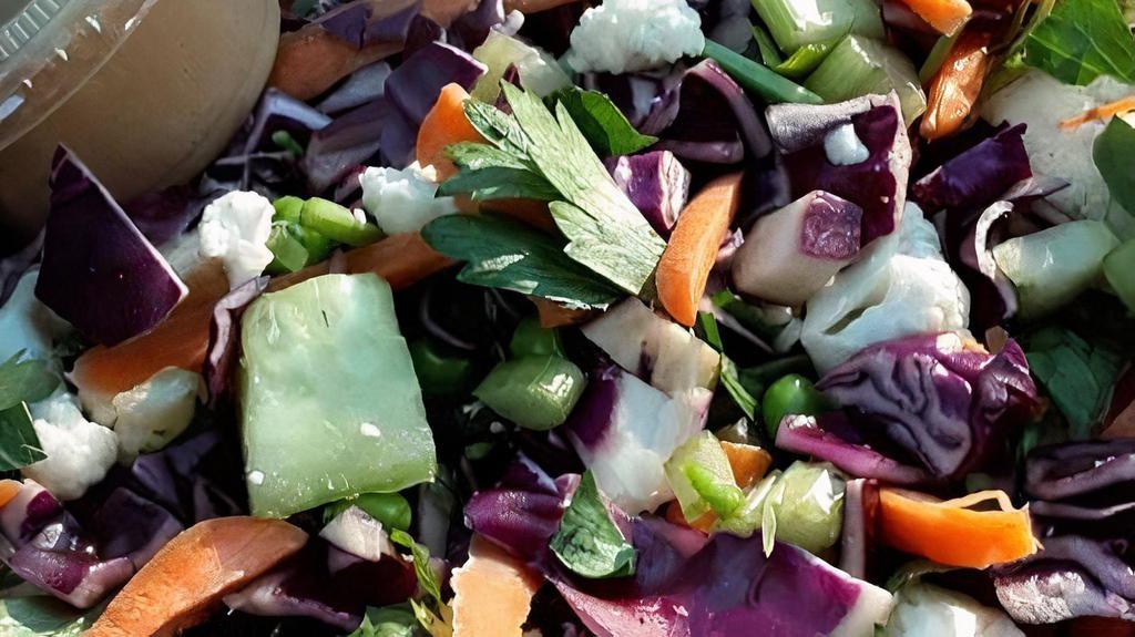 Salad - Entrée · Cauliflower, cucumber, red cabbage, celery, and peas.  Comes with sesame, garlic vinaigrette.