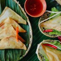 Royal Triangle · Chicken, vegetables wrapped in a crispy rice sheet