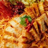 Kow Soi Moo Krob · ข้าวซอยหมูกรอบ 🌶 Crispy pork belly in a curry broth with egg noodles, pickled mustard, red ...