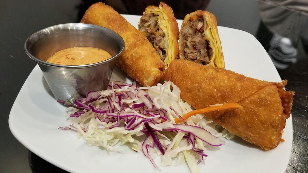Bulgogi Eggrolls · Hand rolled and filled with Korean marinated ribeye meat, bell peppers. And onions, served with a house made spicy mayo sauce..