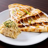Quesadillas · Our cheddar and mozzarella cheese mix with your choice of meat, served in a grilled flour to...