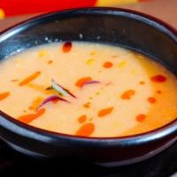 Spicy Corn Soup (V) · roasted sweet corn & fresh cilantro garnished with chili oil