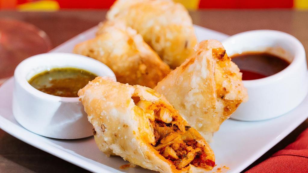 Chicken Murmuri Rolls · hand rolled shredded chicken egg rolls stuffed with peppers and onions - 6 halves