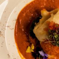 Konkan Fish Curry (Gf) · pan seared sea bass stuffed with shrimp served with sauteed spinach in a velvety tomato base...