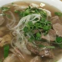 Deluxe Pho Lunch · Combination of rice noodle soup with thinly sliced beef eye round, well-done Angus brisket, ...