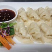 Chicken Dumplings (8) · 8 pieces. Filled with chicken, cabbage and seasonings then steamed.