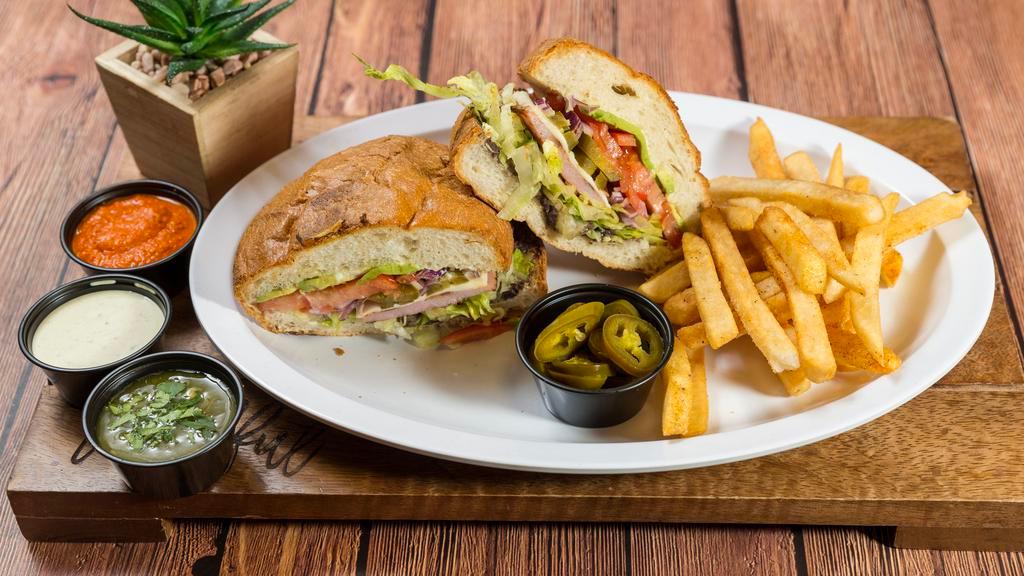 Torta Vegetariana · Mexican bun with refried beans, lettuce, tomato, onions, avocado, and fresco cheese. Served with fries.