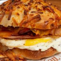 Farmhouse Egg Sandwich  · Fresh Cracked Egg, Thick cut bacon, smoke ham and cheddar cheese with country pepper cream c...