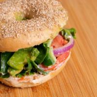 Avocado Veg Out · Avocado, tomatoes, red onions, cucumber, spinach, lettuce with veggie cream cheese on your c...