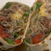 Steak Bomb Wrap · 100% Shaved Steak cooked with onions, peppers, mushrooms with Cheddar Jack Cheese.