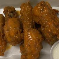 Wings (7) · Fresh Chicken Wings made from scratch tossed in a flour and breadcrumb combo . Cooked to per...