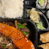 Salmon Teriyaki Bento Box Combo Lunch · Served with gyoza, salad, four piece california roll and rice.