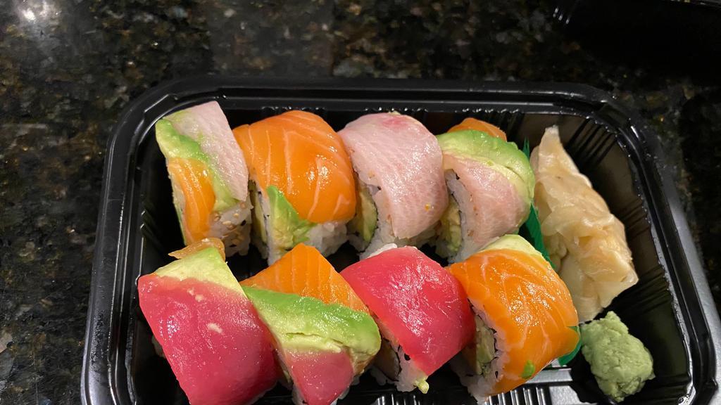 Rainbow Roll · Crabmeat, Cucumber, and Avocado wrapped in seaweed topped with Tuna, Salmon and Yellowtail.