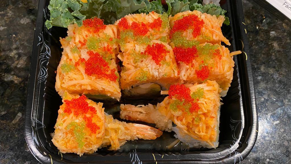 Firecracker Roll · Shrimp tempura, cream cheese, avocado, topped with spicy snow crab, red roe and wasabi tobiko.
