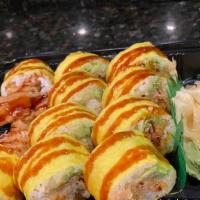 Patriots Roll · Soft-shell crab, shrimp tempura, spicy lobster meat, tobiko avocado and cucumber wrapped in ...