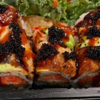Black Dragon Roll · Shrimp tempura & spicy tuna topped with eel, avocado, eel sauce and black tobiko.