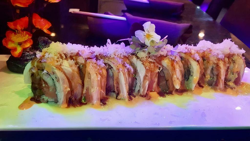 Holiday Roll · Tuna, salmon, yellowtail and asparagus inside. Topped with seared tuna, salmon and yellowtail with a sweet and sour spicy mayo.