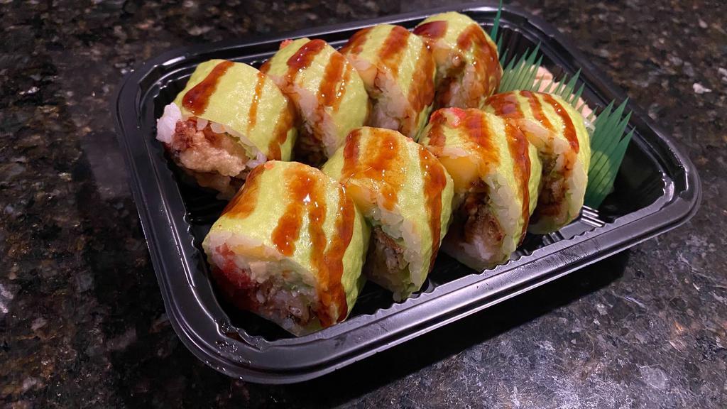 Spider Man Roll · Soft shell crab tempura, cucumber, avocado, spicy tuna, mango, wrapped with soybean paper. Topped with eel sauce