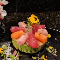 Chirashi · Assortment of raw fish over rice. Served with choice of side.