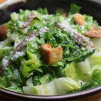Caesar Salad · with anchovy and croutons.