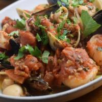 Seafood Fra Diavlo · Shrimp, mussels, and calamari in a spicy marinara sauce served over linguini