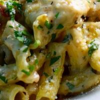 Rosemary Chicken · with pancetta, tomatoes, and asparagus in a garlicky cream sauce over ziti