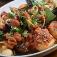 Seafood Fra Diavlo · Shrimp, mussels, and calamari in a spicy marinara sauce served over linguini