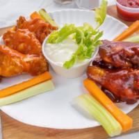 Buffalo Wings · Served with blue cheese and hot, mild, BBQ sauce.