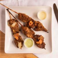 Suya · Spicy skewered beef of kebab with special Chichinga spice, laced with ground nut.