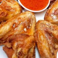 Bukom Mama Wings · Specially seasoned wings to titillate your taste buds. 6 pcs