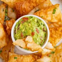 Guacamole With Wanton Chips · Homemade guacamole and you choice of fried or baked wanton chips