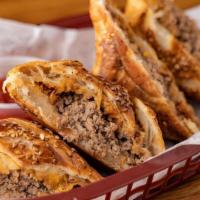 Bacon Cheeseburger Puff · house all beef burger filling and bacon in sesame seed topped puff pastry with sharp cheddar...