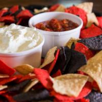 Chips & Salsa · Tortilla chips served with salsa, guacamole, and sour cream. Serves five.