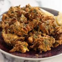 Vegetable Pakora (5) · Fresh vegetable fritters made with spinach, potatoes, onion & cauliflower.