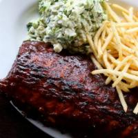 Barbeque Pork Ribs · Our specialties. Slow cooked  ribs topped with BBQ sauce, served with French fried and cole ...