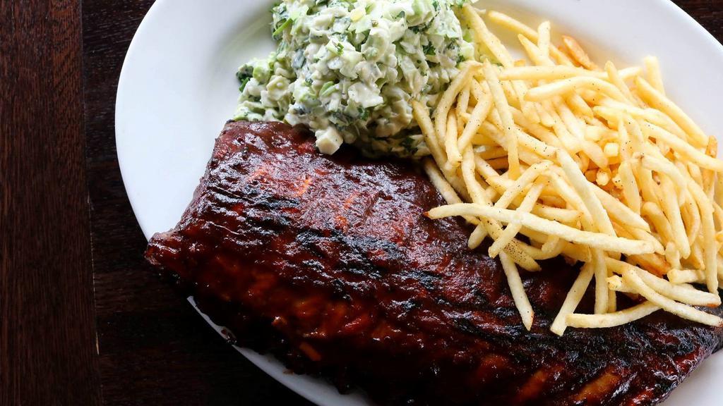Barbeque Pork Ribs · Our specialties. Slow cooked  ribs topped with BBQ sauce, served with French fried and cole slaw.
