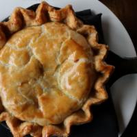Chicken Pot Pie · Homemade crust filled with rotisserie chicken, carrots, peas, and potatoes.