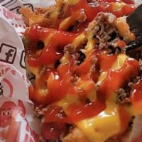 Philly Cheesesteak Fries · Loaded with Chopped sirloin, Cheese Whiz, ketchup and crispy onions.