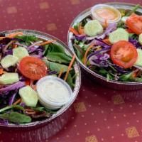 Salad · Fresh spring  alad with red onions, cucumbers, carrots, and tomatoes. Choose with choice of ...