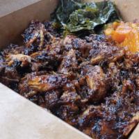 Bbq Chicken · Grilled Chicken Tossed in a Honey Hickory BBQ Sauce , Served with Rice and Peas, Collard Gre...