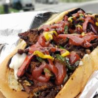 Jerk Chicken Cheesesteak · Grilled Chicken Tossed in our Signature Jerk Sauce, Served on a Toasted Roll and a bag of ch...