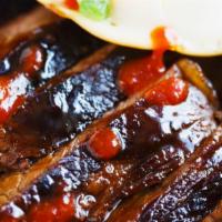 La Galbi Rice Bowl · beef short ribs marinaded in our sweet-soy glaze, served with white rice. side of kimchi, st...