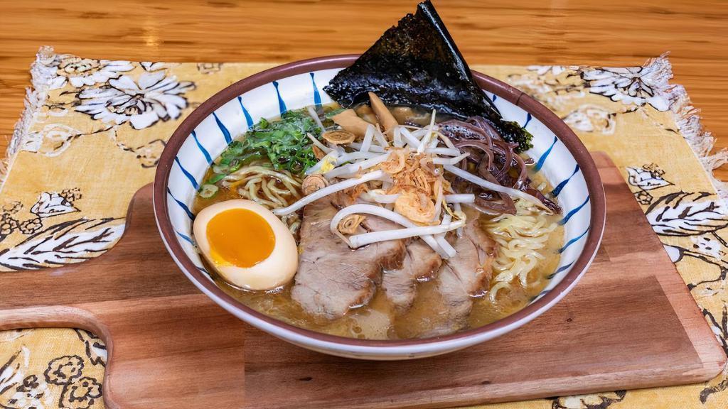 Black Garlic Ramen   · Pork bone broth.with black garlic oil and with thin straigh noodle.Served with Cha Shu(Marinated Pork) chopped scallions.bamboo shoots.kikurage mushrooms. bean sprout.nori. fried red onion and half seasoned boiled egg.