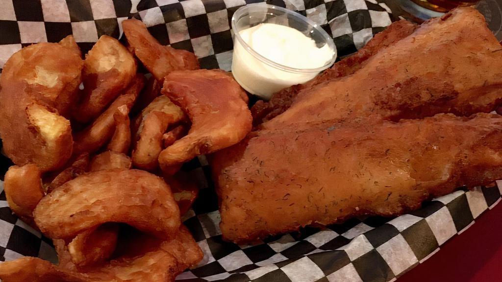 English Style Fish & Chips · Beer battered cod, fried golden brown, served with French fries, cole slaw and a lemon garlic aioli on the side.