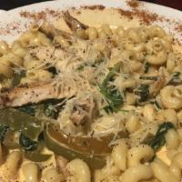 Cajun Pasta · Cavatappi pasta tossed with grilled chicken, spinach and bell peppers in a light Cajun cream...